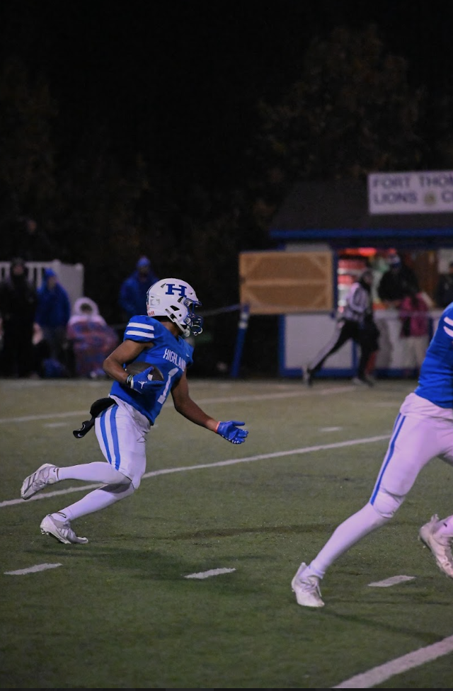 Tyus McCarter (12) running with the ball after getting an interception. "It feels super good to contribute to the team," said McCarter.